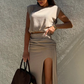 Dámský elegantní top a poloviční sukně s vysokým rozparkem
